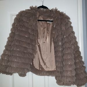 Tan fur jacket.